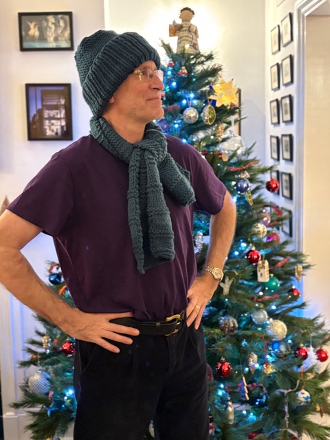 Mark Bryan modelling his hat and scarf knitted by Jill Morrell